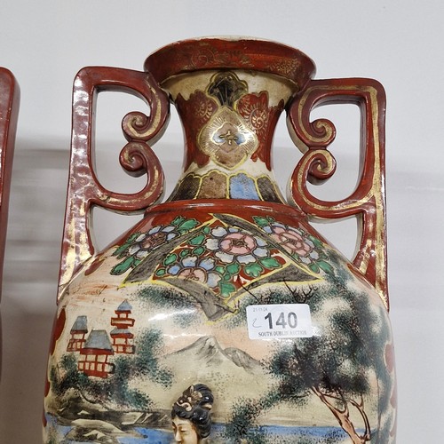 140 - Star Lot: An impressive large antique pair of Japanese satsuma style urn vases. Features moriage gla... 