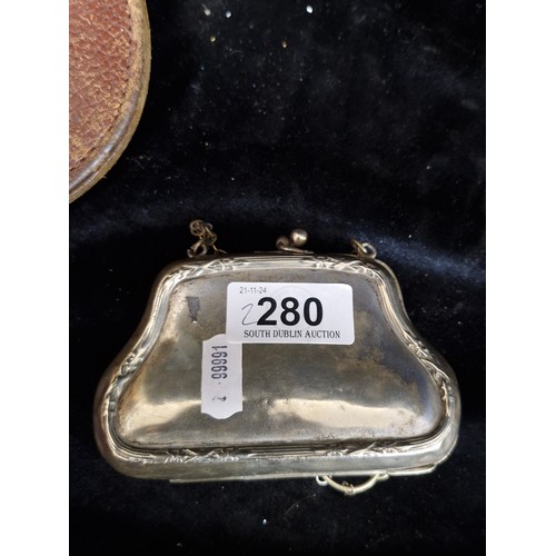 280 - Two antique and vintage accessories including a Victorian EPNS chatelain coin purse with original in... 