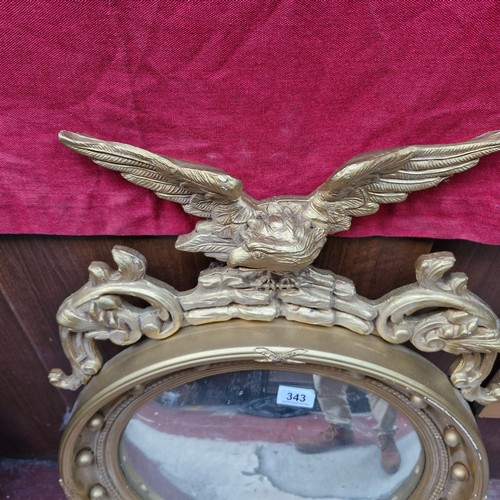 343 - Star Lot : A fabulous large antique mirror with round convex glass housed in a gilt frame featuring ... 