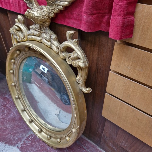 343 - Star Lot : A fabulous large antique mirror with round convex glass housed in a gilt frame featuring ... 