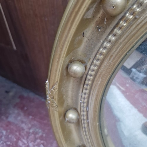 343 - Star Lot : A fabulous large antique mirror with round convex glass housed in a gilt frame featuring ... 