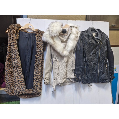 653 - Three ladies jackets including a Zara biker jacket size large,  a River Island faux fur collar belte... 