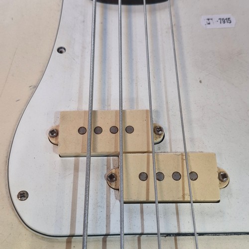 356 - An Encore electric bass guitar in a vintage white finish. RRP £160.00 via worldwidemusic.co.uk