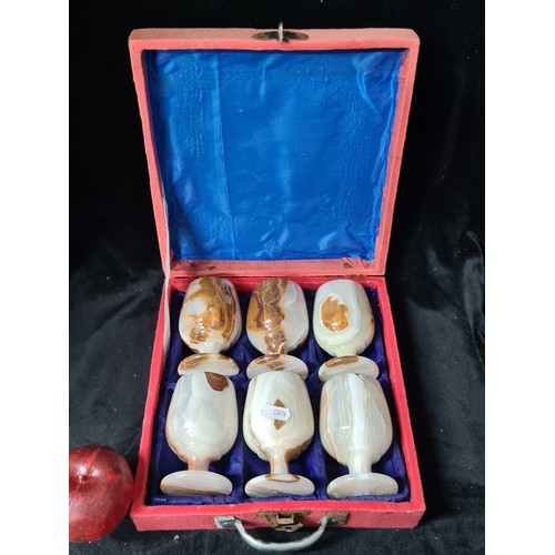 1027 - A set of six Onyx goblets. Presented in a box.