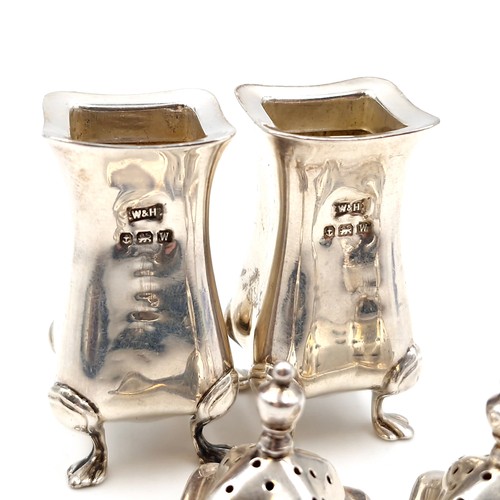 2 - Two silver pepperettes with attractive domed finial tops each set in four paw feet hallmarked Birmin... 