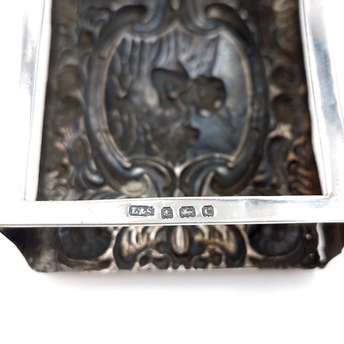 23 - A silver Vesta box holder hallmarked Birmingham with attractive repousse face. Dimensions: 7 x 5 cms... 