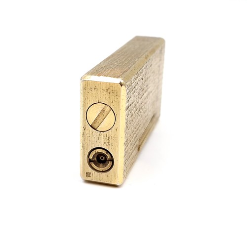 33 - A Flaminaire gold metal lighter. Dimensions: 6 x 3 cms. Weight - 82 grams. As per photographed. Info... 