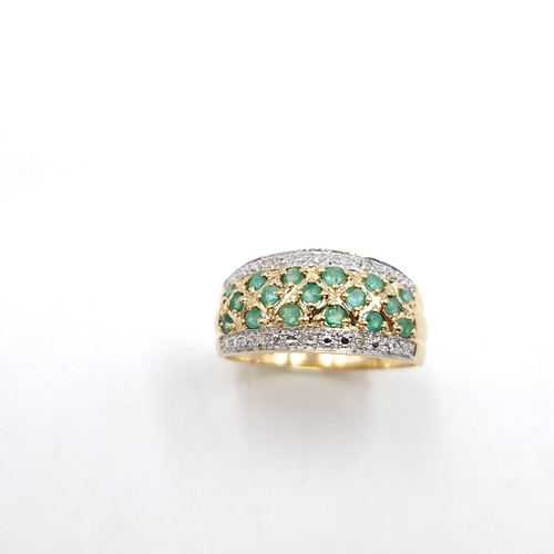 49 - Star Lot : A stunning good weight 14 carat gold (585) emerald and diamond cluster ring. Size - R. We... 