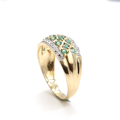 49 - Star Lot : A stunning good weight 14 carat gold (585) emerald and diamond cluster ring. Size - R. We... 