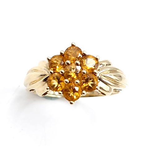 51 - Star Lot : A pretty petal style nine carat gold citrine wide band ring. Size - O. Weight - 3.31 gram... 