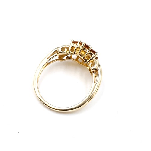 51 - Star Lot : A pretty petal style nine carat gold citrine wide band ring. Size - O. Weight - 3.31 gram... 