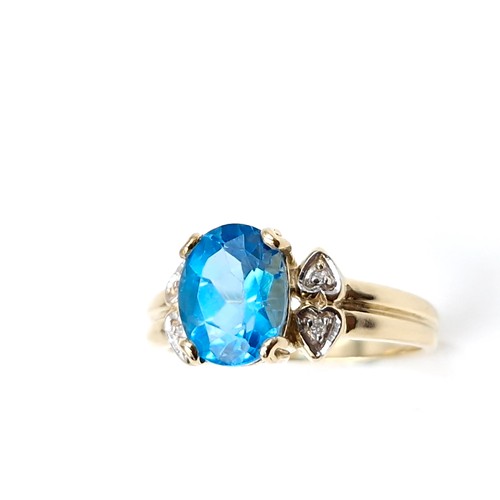 57 - Star Lot : A beautiful nine carat gold fine blue large topaz and diamond stone ring. Size - M. Weigh... 