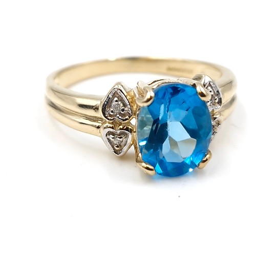 57 - Star Lot : A beautiful nine carat gold fine blue large topaz and diamond stone ring. Size - M. Weigh... 