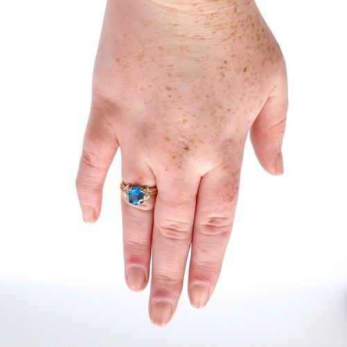 57 - Star Lot : A beautiful nine carat gold fine blue large topaz and diamond stone ring. Size - M. Weigh... 