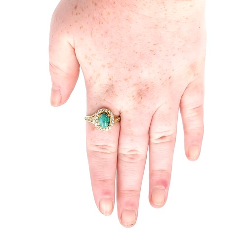 548 - A nine carat gold plated malachite cabochon stone ring with gem set mount and surround. Size - W. We... 