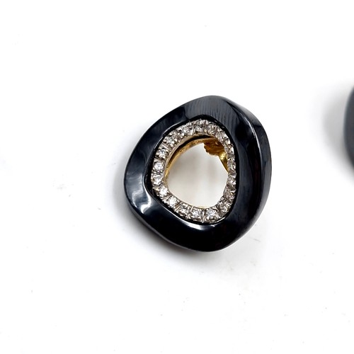 574 - Star Lot : A pair of 18 carat gold diamond and onyx stud earrings - marks stamped to post. Weight - ... 