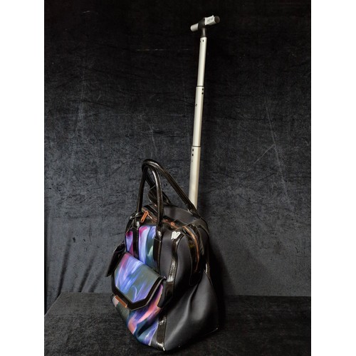 1016 - A smart and practical designer Ted Baker makeup artists travel bag. Set on castor wheels with extend... 