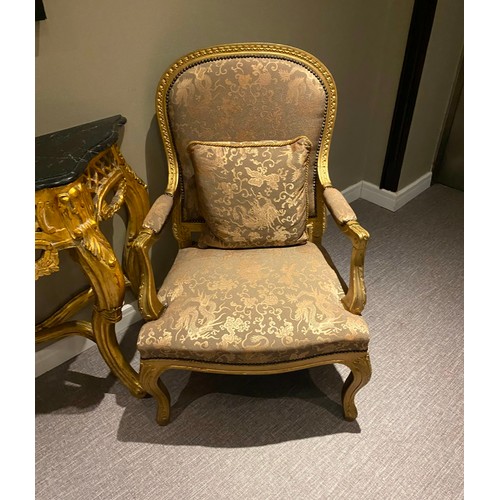 709 - Star lot : A lovely pair of Gold damask armchairs. With carved gold frames and matching pillows in g... 