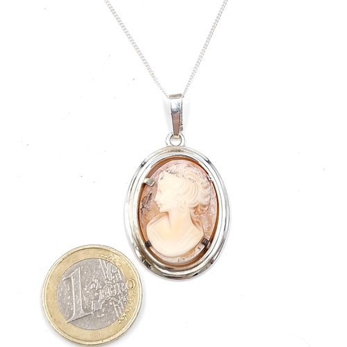 22 - A vintage silver cameo pendant together with chain. Length - 42 cms. Weight - 6.5 grams.