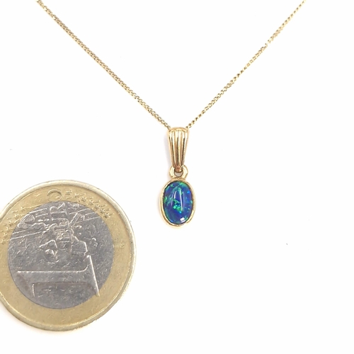 30 - A beautiful blue fire opal nine carat gold pendant necklace. Length of chain - 44 cms. Weight - 1.48... 