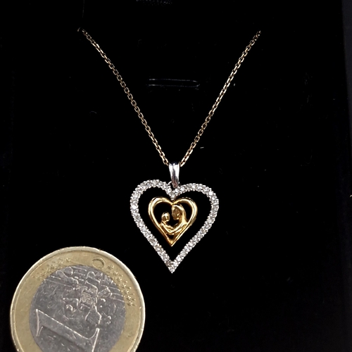 31 - Star Lot : A very pretty heart shaped pendant with diamond setting together with a nine carat gold c... 