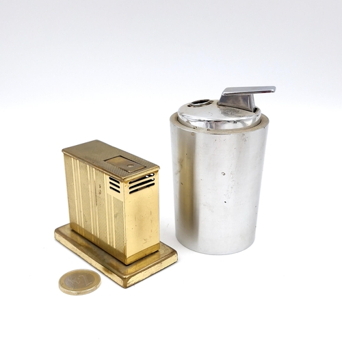 501 - Two table lighters - an engine turned example with brass fittings. Together with a Piezo electric ga... 