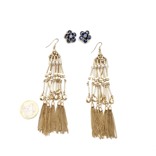 510 - Two pairs of earrings - A tassel/pendant set together with a pair of gem set clasp earrings.