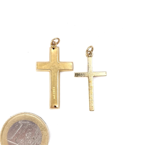 534 - Two nine carat gold cross pendants. Total weight - 3 grams.