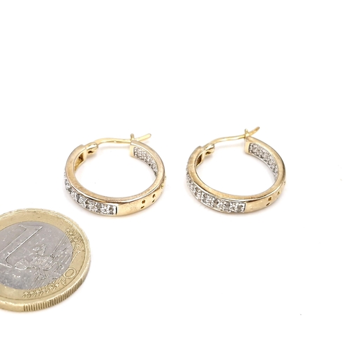 535 - Star Lot : A heavy pair of nine carat gold diamond circular earrings - suitable for pierced ears. To... 