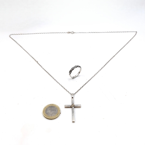 545 - A silver ring (Size - P 1/2) together with a silver cross pendant & chain. Length of chain - 62 cms.... 