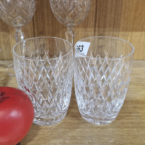 663 - A pair of Waterford Crystal tall tumbler whiskey glasses. In the Lismore pattern. With acid marks to... 