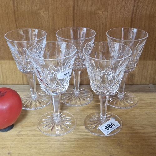 664 - Five Waterford crystal stemmed drinking glasses. With acid marks to base. In excellent condition.