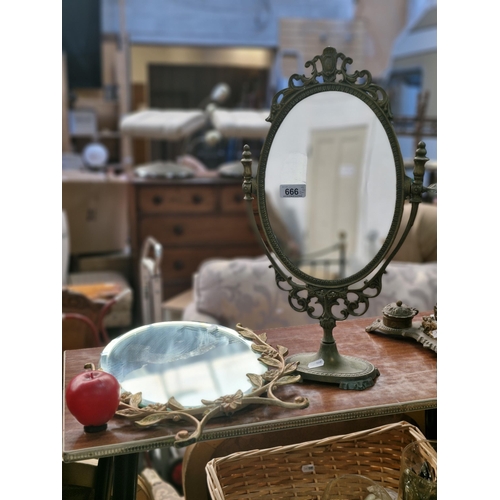 666 - Two elegant vintage Vanity mirrors. Includes one beveled example with a gilt floral frame.