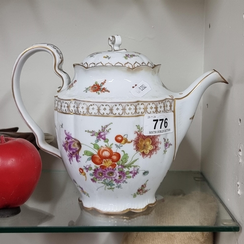 776 - A very pretty vintage Dresden teapot with floral design and gilt decoration. In good condition, stam... 