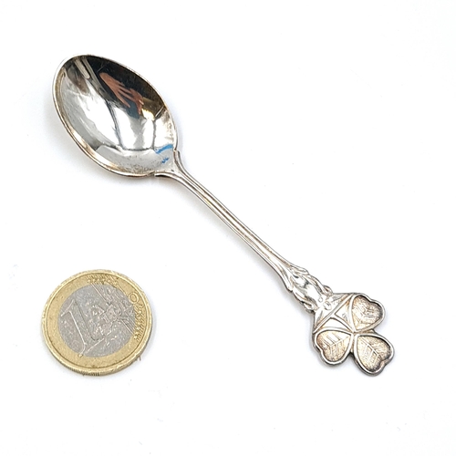 572 - An Irish silver clover spoon. Weight - 11.39 grams. Boxed.