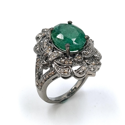 583 - Star Lot : An emerald stone ring set with diamond mount and set in sterling silver. Size - O. Weight... 