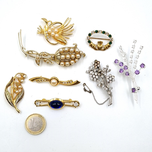 599 - A nice collection of eight gem set brooches. All with pins intact. As per photographed.