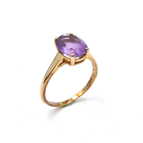 607 - A pretty 10 carat gold large amethyst gemstone ring. Size - P. Weight - 2.4 grams. Boxed.