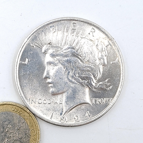 621 - A 1924 US Peace silver one dollar .9999 silver once . 100 years old.