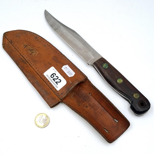 622 - A Bowie knife made by Nowill Sheffield eng. Set with wooden handle and leather sheath. Dimensions: B... 