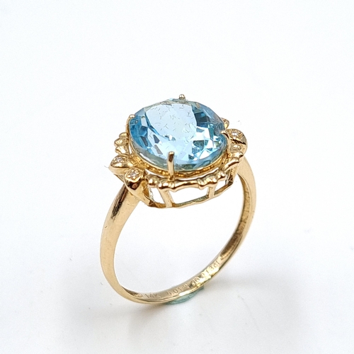 634 - Star Lot: A most attractive 5.01ct blue topaz stone set with 0.013ct diamonds, mounted in 14 carat g... 