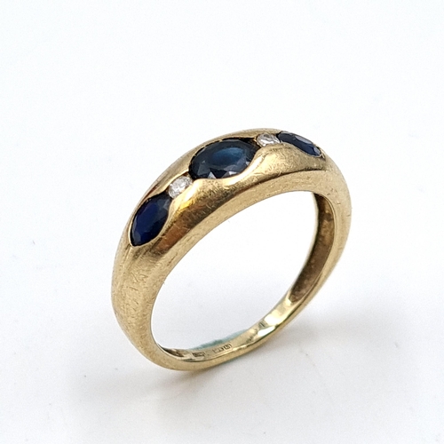 638 - Star Lot: A lovely sapphire and diamond ring set in nine carat gold. Stamped 375. Ring size K1/2. To... 