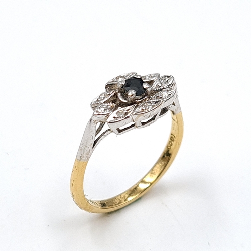 639 - Star Lot: An 18 carat gold ring set with diamonds and a sapphire stone. Stamped 18ct to band. Ring s... 