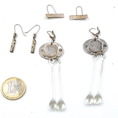 646 - Three most unusual pairs of drop pendant earrings including a sterling silver pair with hand blown g... 