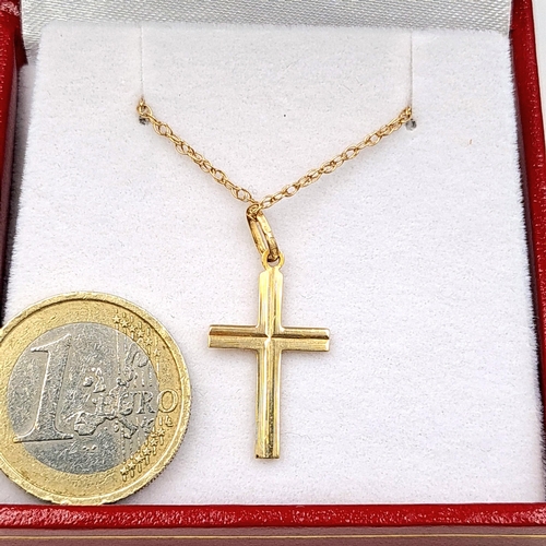 647 - Star Lot: A nine carat gold (375) cross pendant necklace paired with a dainty nine carat gold chain ... 