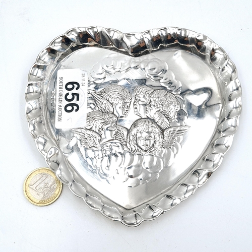 656 - A dainty sterling silver heart-shaped pin dish. The centre is embossed with Reynolds Angels and woul... 