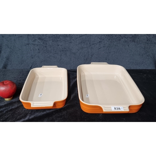 838 - Two Le Creuset orange cast iron roasters. RRP: €255 (smaller) and €305 (bigger) on lecreuset.ie