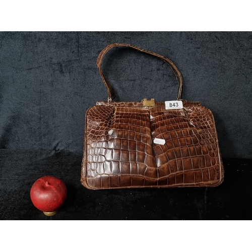 843 - A vintage designer Beverly Bag full crocodile leather hand bag complete with brass hardware. From th... 