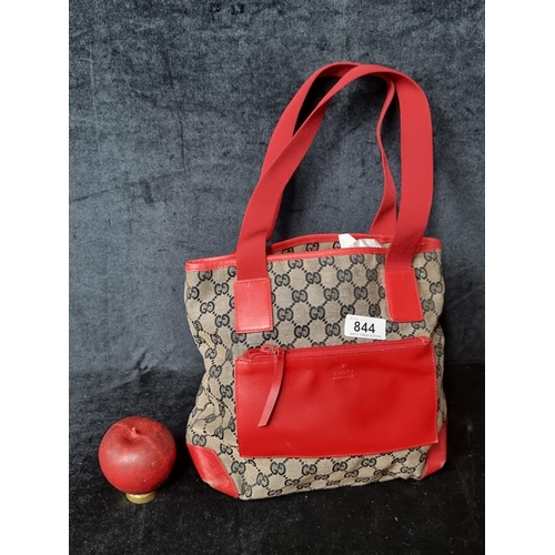 844 - Star lot : A genuine vintage designer Gucci red and brown shoulder bag. Features a canvas body with ... 