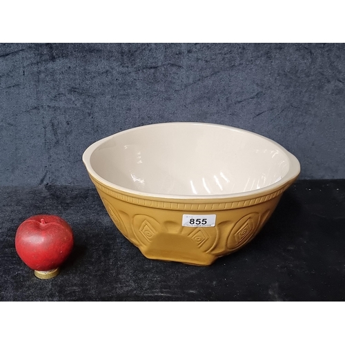 855 - A large ceramic Mixing bowl. In a lovely ochre shade with symmetrical patterns.